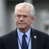 White House trade adviser Peter Navarro listens to a news conference about a presidential executive order relating to military veterans outside of the West Wing of the White House in Washington, U.S. March 4, 2019. REUTERS/Leah Millis