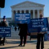 WASHINGTON, DC - JANUARY 13: Protesters who align with the Democratic Party but are against transgender athletes competing in women's sports gather outside the Supreme Court on January 13, 2026 in Washington, DC. Groups from both sides of the debate gathered on Tuesday morning to protest while two cases that prohibit transgender girls from joining girls' and women's sports teams are heard inside the Supreme Court. (Photo by Heather Diehl/Getty Images)
