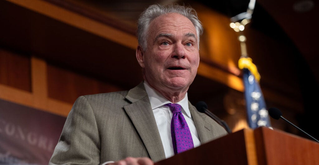 Virginia Democrat Senator Tim Kaine talks to reporters in the capitol.
