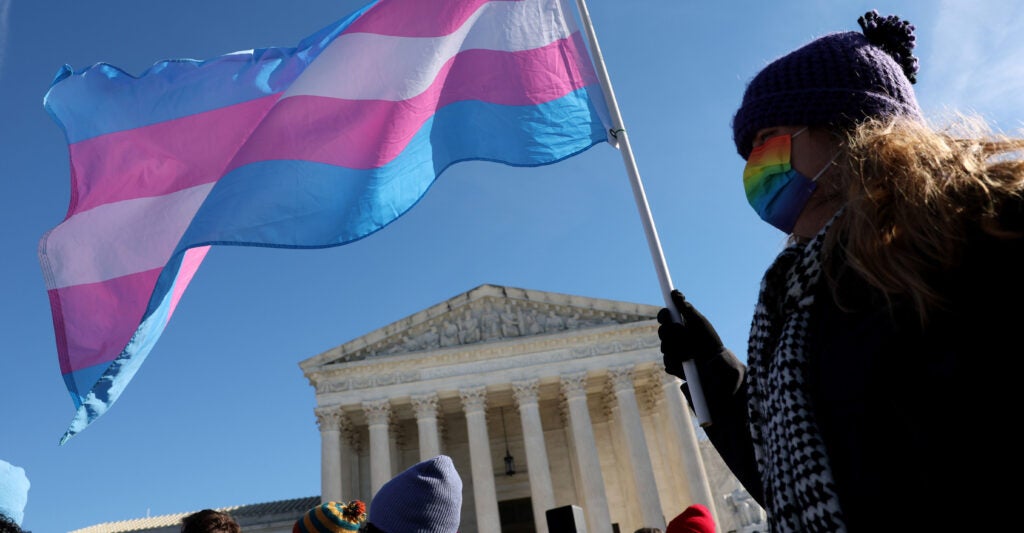 WASHINGTON, DC - DECEMBER 04: A transgender rights supporter takes part in a rally outside of the U.S. Supreme Court as the high court hears arguments in a case on transgender health rights on December 04, 2024 in Washington, DC. The Supreme Court is hearing arguments in US v. Skrmetti, a case about Tennessee's law banning gender-affirming care for minors and if it violates the Constitution’s equal protection guarantee. (Photo by Kevin Dietsch/Getty Images)