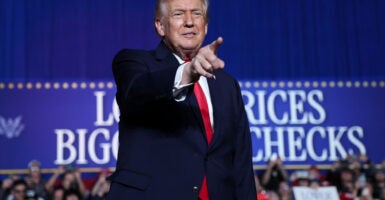 Donald Trump points at the crowd.