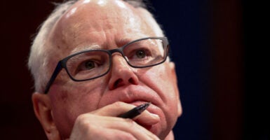 FILE PHOTO: Minnesota Governor Tim Walz looks on during a House Oversight Committee hearing with U.S. governors about state policies regarding undocumented migrants, on Capitol Hill in Washington, D.C., U.S., June 12, 2025. REUTERS/Kevin Lamarque/File Photo