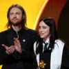 LOS ANGELES, CALIFORNIA - FEBRUARY 01: FINNEAS and Billie Eilish accept the Song of the Year award for "WILDFLOWER" onstage during the 68th GRAMMY Awards at Crypto.com Arena on February 01, 2026 in Los Angeles, California. (Photo by Kevin Mazur/Getty Images for The Recording Academy)
