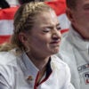 Olympic skater Amber Glenn makes a face as she awaits her disappointing score at the Olympics.