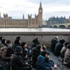 LONDON, UNITED KINGDOM - 2026/01/18: Worshippers seen sitting during the religious event. Shia Muslims gathered at Westminster Bridge to commemorate the martyrdom of Imam Musa al-Kazim taking part in a religious procession marked by ritual chest beating known as Azadari and Matam. The annual observance honours the seventh Shia Imam and serves as a public expression of mourning, sacrifice, and devotion within the Shia Islamic tradition. (Photo by Andrea Domeniconi/SOPA Images/LightRocket via Getty Images)