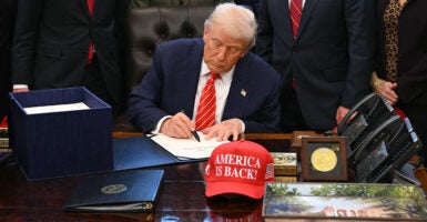 US President Donald Trump signs a funding bill to end a partial government shutdown in the Oval Office of the White House in Washington, DC, on February 3, 2026. The US House of Representatives passed a spending bill on Tuesday ending the four-day partial government shutdown sparked by Democratic opposition to funding for the federal agency carrying out President Donald Trump's immigration crackdown. (Photo by SAUL LOEB / AFP via Getty Images)