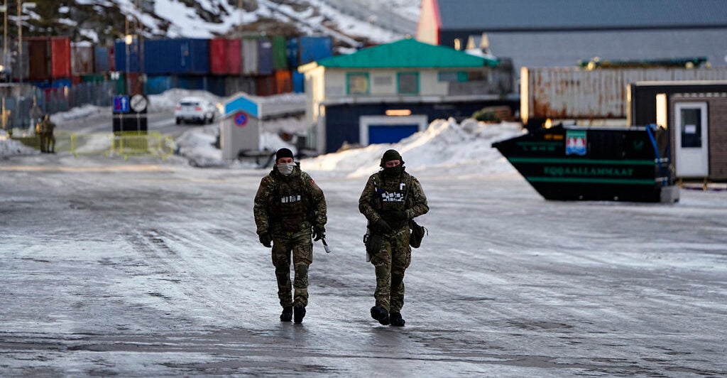 Soldiers are pictured as they guard the harbor in Nuuk, Greenland, on January 25, 2026. (Photo by Mads Claus Rasmussen / Ritzau Scanpix / AFP via Getty Images) / Denmark OUT