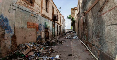 Maracaibo, Venezuela. The historic center of the oil capital of Maracaibo, the commercial center of the state of Zulia. Following oil exploitation, with the Dutch company Shell and the American Creole Petroleum Corporation, the local economy began to boom, local merchants establishing themselves and maintaining commercial activity in Baralt Square and its surrounding areas for over a century. After the arrival of the late Venezuelan socialist military president, Hugo Chavez, the country's economy suffered severe distortions that led to several devaluations of the Venezuelan currency, the Bolivar, impoverishing the country's merchants. Today, Plaza Baralt and its buildings display the solitude and deterioration, symbolizing how ill-conceived political ideologies lead to the economic decline of people. (Photo by: Jose Bula Urrutia/UCG/Universal Images Group via Getty Images)
