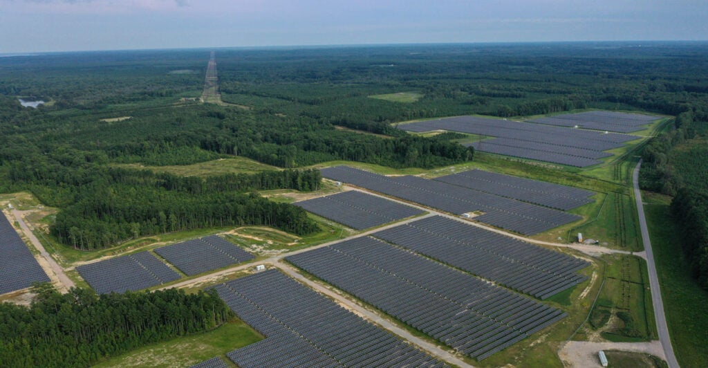 In an aerial view, the Amazon Fort Powhatan Solar Farm is seen on August 19, 2022 in Disputanta, Virginia. Amazon has partnered with Dominion Energy to build over 19 solar farms in the state, which are used to power Amazon Web Services, its cloud-computing service, and eventually its HQ2 location in Northern Virginia once complete. Amazon is the world's largest corporate buyer of renewable energy, with a company pledge to use 100% renewable energy for all of its operations by 2030. (Photo by Drew Angerer/Getty Images)