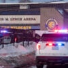Police stand outside the perimeter they created around the Dennis M. Lynch Arena where a shooting occurred earlier today in Pawtucket, Rhode Island, on February 16, 2026. At least two people were killed and three wounded in a shooting at an ice rink in the northeastern US town of Pawtucket on Monday, authorities said, with social media footage showing frightened teenagers fleeing the sound of gunshots. "We have three deceased. The suspect, and then we have two victims, and then we have three at the hospital," said Pawtucket police chief Tina Goncalves told reporters after the incident. She added that initial investigations suggested the shooting was targeted and "may be a family dispute." (Photo by Joseph Prezioso / AFP via Getty Images)