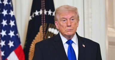 US President Donald Trump looks on during the Angel Families Remembrance Ceremony in the East Room of the White House in Washington, DC, on February 23, 2026. (Photo by SAUL LOEB / AFP via Getty Images)