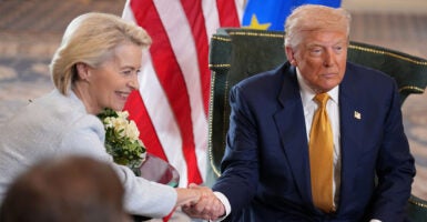 President Donald Trump shakes hands with President of the European Commission Ursula von der Leyen. (Photo by Andrew Harnik/Getty Images)