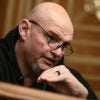 Close-up of John Fetterman speaking during a hearing.