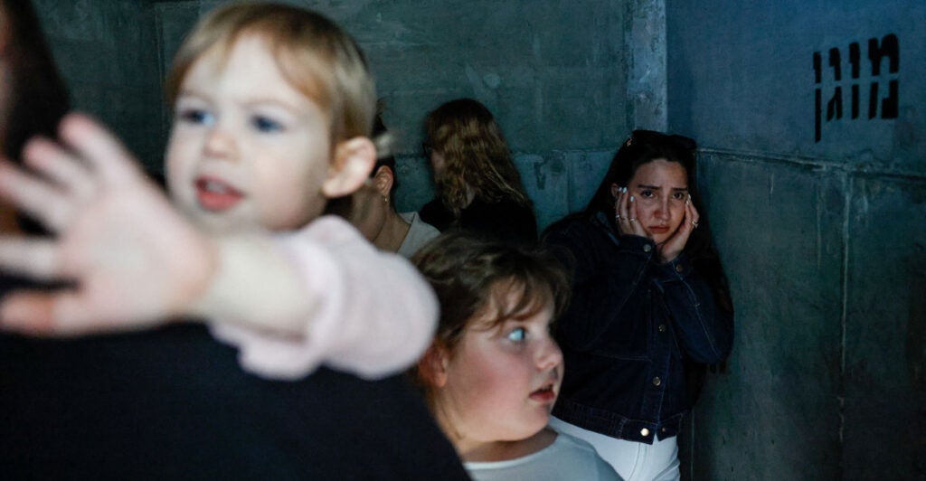 People take shelter, after missiles were launched from Iran towards Israel, following Israel and U.S. strikes on Iran, in Ashkelon, Israel, February 28, 2026. REUTERS/Amir Cohen