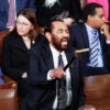 Rep. Al Green raises his cane to shout at President Donald Trump during the State of the Union.