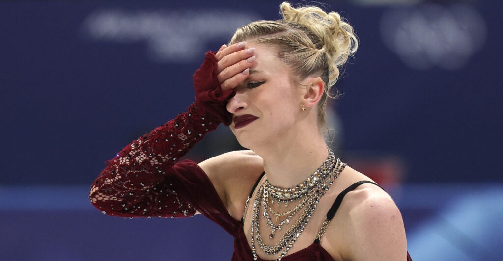 Amber Glenn gets emotional after failing to complete an element competes during the women's short program figure skating at the 2026 Winter Olympics, in Milan, Italy, Tuesday, Feb. 17, 2026. (Robert Gauthier / Los Angeles Times via Getty Images)