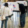 BELTSVILLE, MD - NOVEMBER 5: Voting booths and voters are seen at a polling location at Beltsville Academy on Election Day, Tuesday, November 5, 2024, in Beltsville, Maryland. (Photo by Graeme Sloan for The Washington Post via Getty Images)