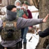 MINNEAPOLIS, MINNESOTA - FEBRUARY 05: Observers film ICE agents as they hold a perimeter after one of their vehicles got a flat tire on Penn Avenue on February 5, 2026 in Minneapolis, Minnesota. Protests continue calling for an end to immigration raids in the Twin cities which have already resulted in the fatal shooting deaths of Alex Pretti, a VA nurse, and Renee Good, a mother of three, by federal agents. (Photo by Stephen Maturen/Getty Images)