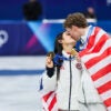 Gold medalists Madison Chock and Evan Bates of Team United States share a kiss after the medal ceremony for the Team Event on day two of the Milano Cortina 2026 Winter Olympic games at Milano Ice Skating Arena on February 8, 2026 in Milan, Italy.