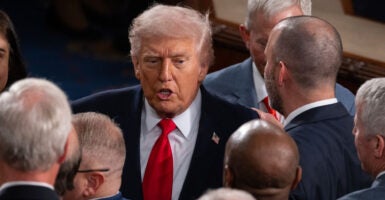 President Donald Trump greets congressmen at the State of the Union Address.