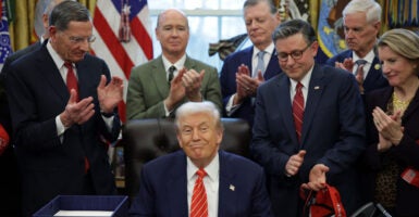 Senate Majority Whip John Barrasso (R-WY), U.S. President Donald Trump and Speaker of the House Mike Johnson (R-LA) attend a bill signing in the Oval Office of the White House on February 03, 2026
