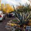 Pima County Sheriffs deputies prepare for a shift change outside of Nancy Guthrie's residence.