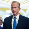 Senate Majority Leader John Thune walks through the United States Capitol.