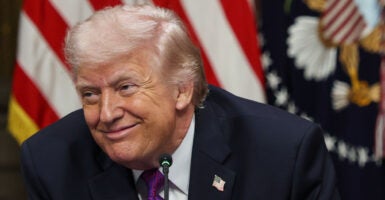 WASHINGTON, DC - MARCH 04: U.S. President Donald Trump listens to speakers during a roundtable meeting on the administration's 