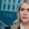Close-up of Karoline Leavitt in White House Briefing Room.