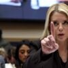 U.S. Attorney General Pam Bondi holding up one finger