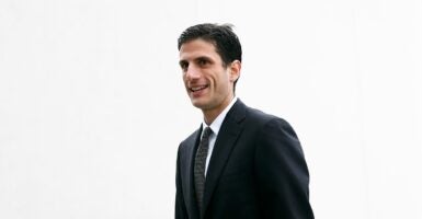 Jack Schlossberg walking against a white background.