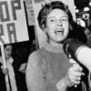Black-and-white photo of Phyllis Schlafly, megaphone in hand, leading a rally against the Equal Rights Amendment.