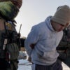 MINNESOTA, US - JANUARY 27: US Immigration and Customs Enforcement (ICE) agents detain a young man while conducting federal enforcement operations in St. Paul, Minnesota, United States on January 27, 2026. (Photo by Madison Thorn/Anadolu via Getty Images)