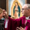 Garden Grove, CA - March 02: A woman receives ashes from Bishop Timothy Freyer during an Ash Wednesday Mass at Christ Cathedral in Garden Grove, CA on Wednesday, March 2, 2022. Ash Wednesday is the start of Lent, a time for Christians to fast and reflect leading up to Easter. (Photo by Paul Bersebach/MediaNews Group/Orange County Register via Getty Images)