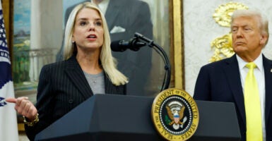 WASHINGTON, DC - OCTOBER 15: U.S. Attorney General Pam Bondi (L) speaks as U.S. President Donald Trump looks on during a press conference in the Oval Office of the White House on October 15, 2025 in Washington, DC. Trump and Federal Bureau of Investigation Director Kash Patel provided an update on the Trump administration’s progress in reducing violent crime. (Photo by Kevin Dietsch/Getty Images)