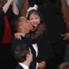 Marcus Coleman holds his daughter at the State of the Union address.
