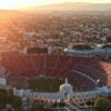 In an aerial view, the Los Angeles Memorial Coliseum and Lucas Museum of Narrative Art (R) in Exposition Park is shown on March 5, 2026 in Los Angeles, California. The stadium will host the 2026 FIFA World Cup and the 2027 LA Olympics.