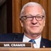 Sen. Kevin Cramer seated.