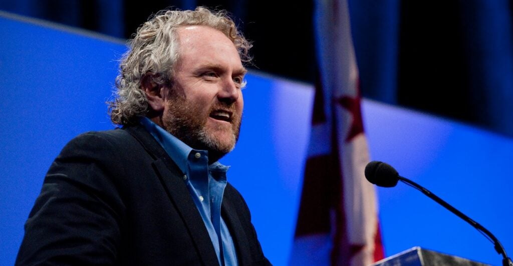 A man speaking at a podium.