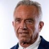 Robert F. Kennedy Jr. in front of a white and black wall.