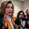 Nancy Pelosi talking with reporters.