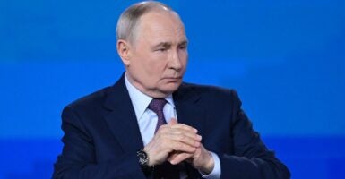 Vladimir Putin seated