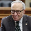 Chuck Schumer sits in a senate meeting.