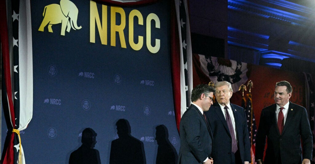 (L/R) US Speaker of the House Mike Johnson (R-LA), US President Donald Trump and NRCC chairman Richard Hudson speak as they attend the National Republican Congressional Committee fundraiser.