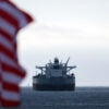 A US flag and a CHIOS crude oil tanker sits anchored off the coast of the Chevron's El Segundo Refinery in El Segundo, California on March 4, 2026.