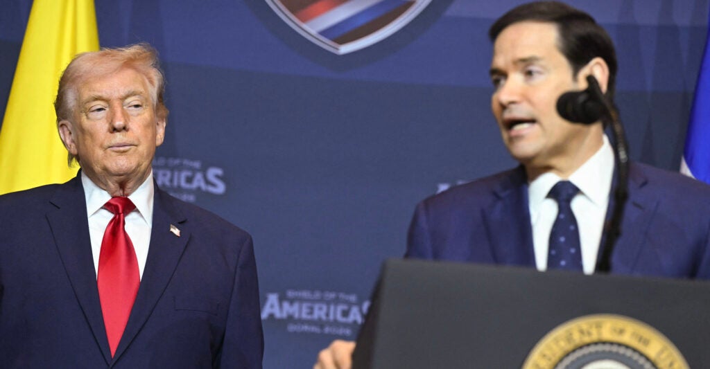 US President Donald Trump looks on as Secretary of State Marco Rubio (R) speaks during the "Shield of the Americas" Summit at Trump National Doral in Miami, Florida, March 7, 2026. (Photo by SAUL LOEB / AFP via Getty Images)
