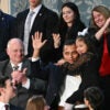 7-year-old Dalilah Coleman, held by her father Marcus Coleman as they are recognized by US President Donald Trump as he delivers the State of the Union address in the US Capitol in Washington, DC, on February 24, 2026.