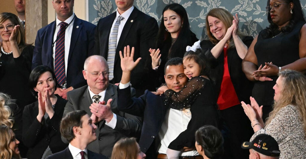 7-year-old Dalilah Coleman, held by her father Marcus Coleman as they are recognized by US President Donald Trump as he delivers the State of the Union address in the US Capitol in Washington, DC, on February 24, 2026.