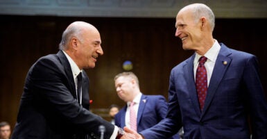 Sen. Rick Scott and entrepreneur Kevin O'Leary shake hands