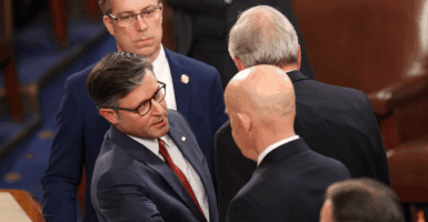 Mike Johnson shakes hands with Rep. Keith Self.
